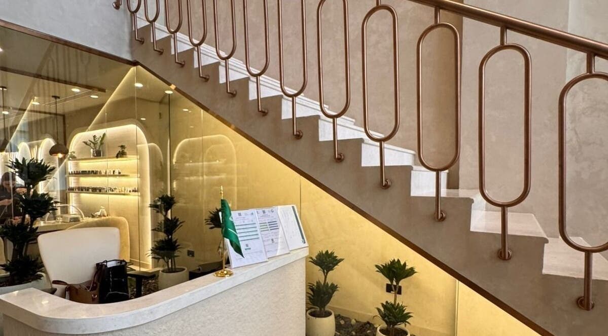 Elegant reception area at OASIS BEAUTY HOUSE, Riyadh, Riyadh Province, SA, featuring modern decor and warm lighting.