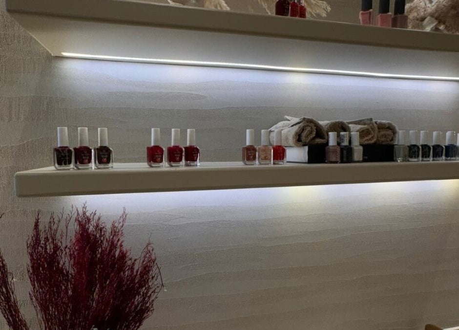 Nail polish bottles on illuminated shelves at OASIS BEAUTY HOUSE, Riyadh, Riyadh Province, SA.