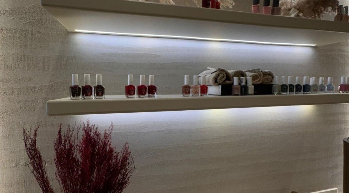 Nail polish bottles on illuminated shelves at OASIS BEAUTY HOUSE, Riyadh, Riyadh Province, SA.