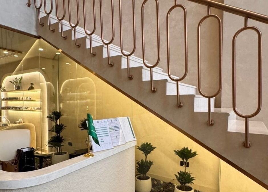 Elegant reception area at OASIS BEAUTY HOUSE, Riyadh, Riyadh Province, SA with chic decor under staircase.
