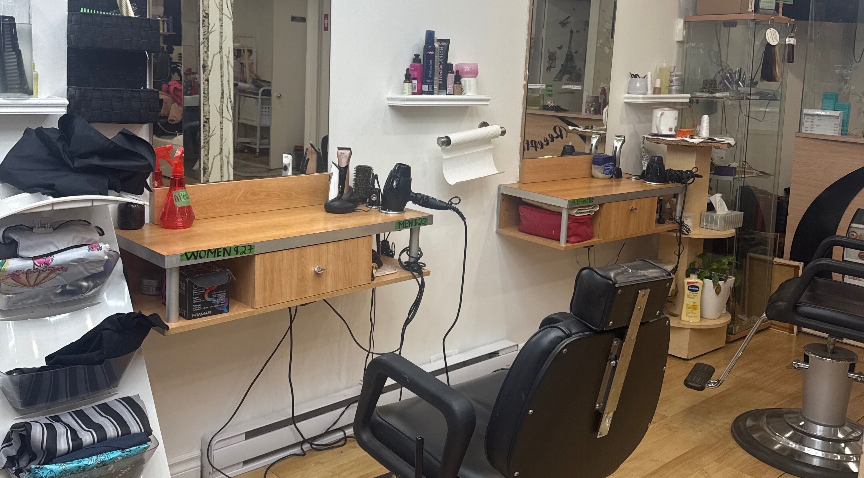 Modern hairstyling station at Salon Mita, Montreal, Québec, CA. Includes mirrors and hair tools.
