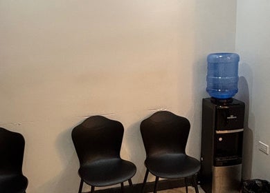 Waiting area with chairs and water cooler at Dr. Orchid Dawkins/Skin Institute of Jamaica, Kingston, St. Andrew Parish, JM.