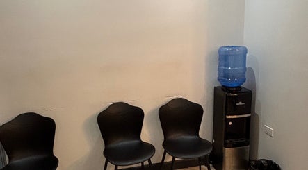 Waiting area with chairs and water cooler at Dr. Orchid Dawkins/Skin Institute of Jamaica, Kingston, St. Andrew Parish, JM.