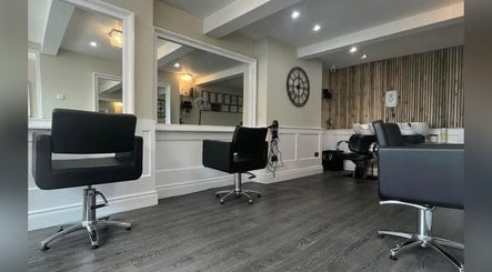 Chic interior of Amt Hair & Extensions in Ballymena, Northern Ireland, GB, featuring modern styling chairs.