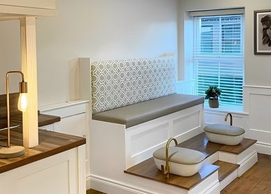 Inviting seating area at Amt Hair & Extensions in Ballymena, Northern Ireland, GB with elegant decor.