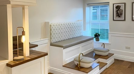 Inviting seating area at Amt Hair & Extensions in Ballymena, Northern Ireland, GB with elegant decor.