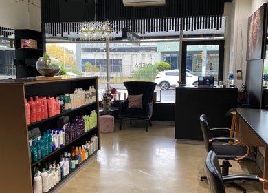 Interior of Lotus Hair Salon in Camberwell, Victoria, AU, showcasing elegant decor and a product display.