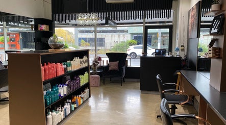 Interior of Lotus Hair Salon in Camberwell, Victoria, AU, showcasing elegant decor and a product display.
