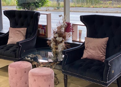 Chic lounge area at Lotus Hair Salon, Camberwell, Victoria, AU, featuring plush chairs and stylish decor.