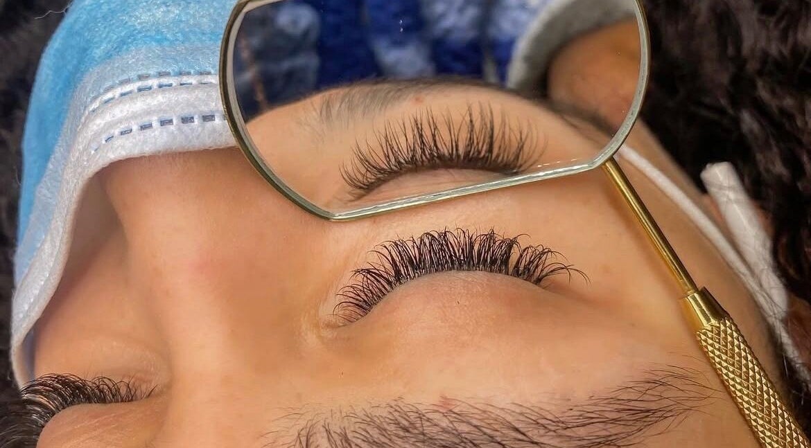 Close-up of a client's enhanced eyelashes at GuchiGlowUp in Eugene, Oregon, US showcasing meticulous detail.
