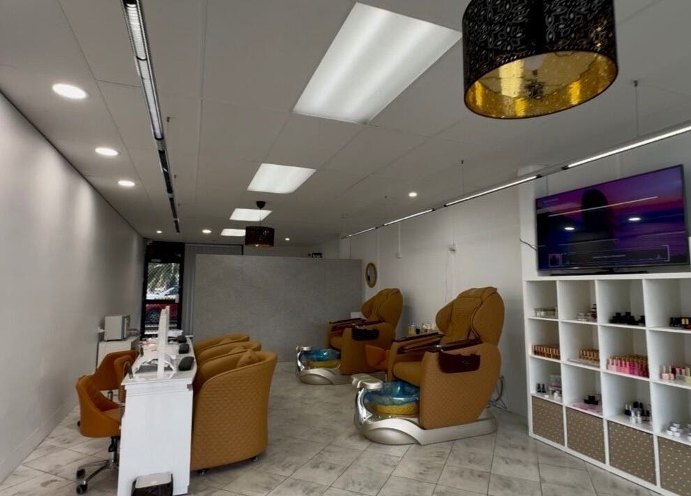 Interior of Eloura Nail in Plympton, South Australia, AU featuring modern pedicure chairs and polish display.