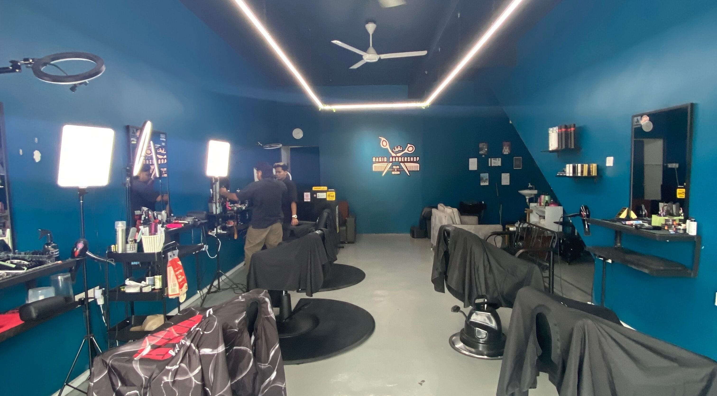Interior of Daqiq Barbershop showcasing modern barber chairs in Simpang Empat, Kedah, MY.