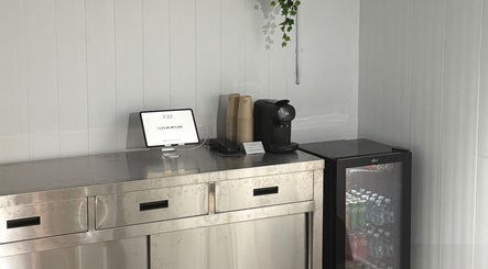Refreshment area at STUDIO.M, Camperdown, New South Wales, AU, with drinks and a tablet.