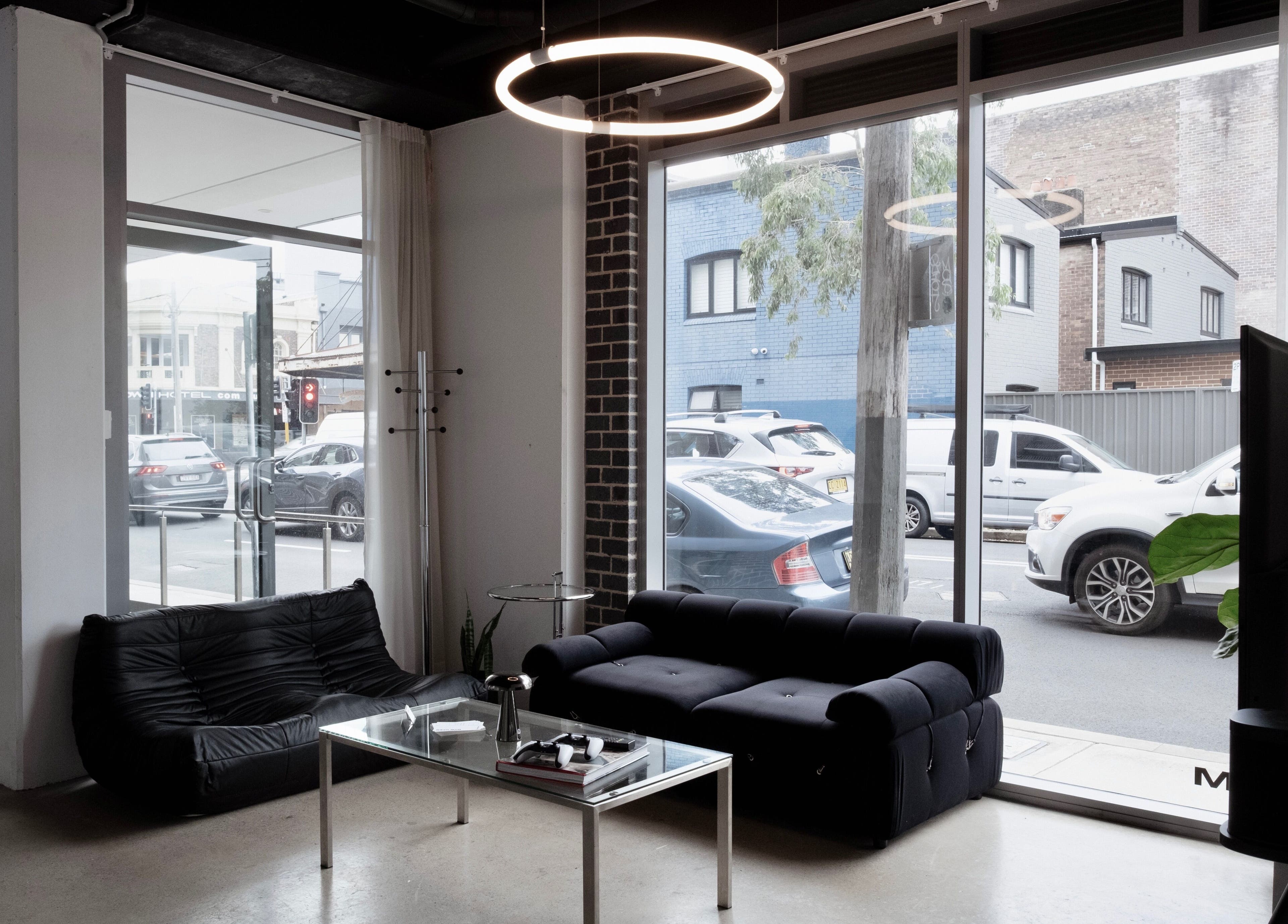 Contemporary lounge area at Studio.M, Camperdown, New South Wales, AU with modern decor and street view.