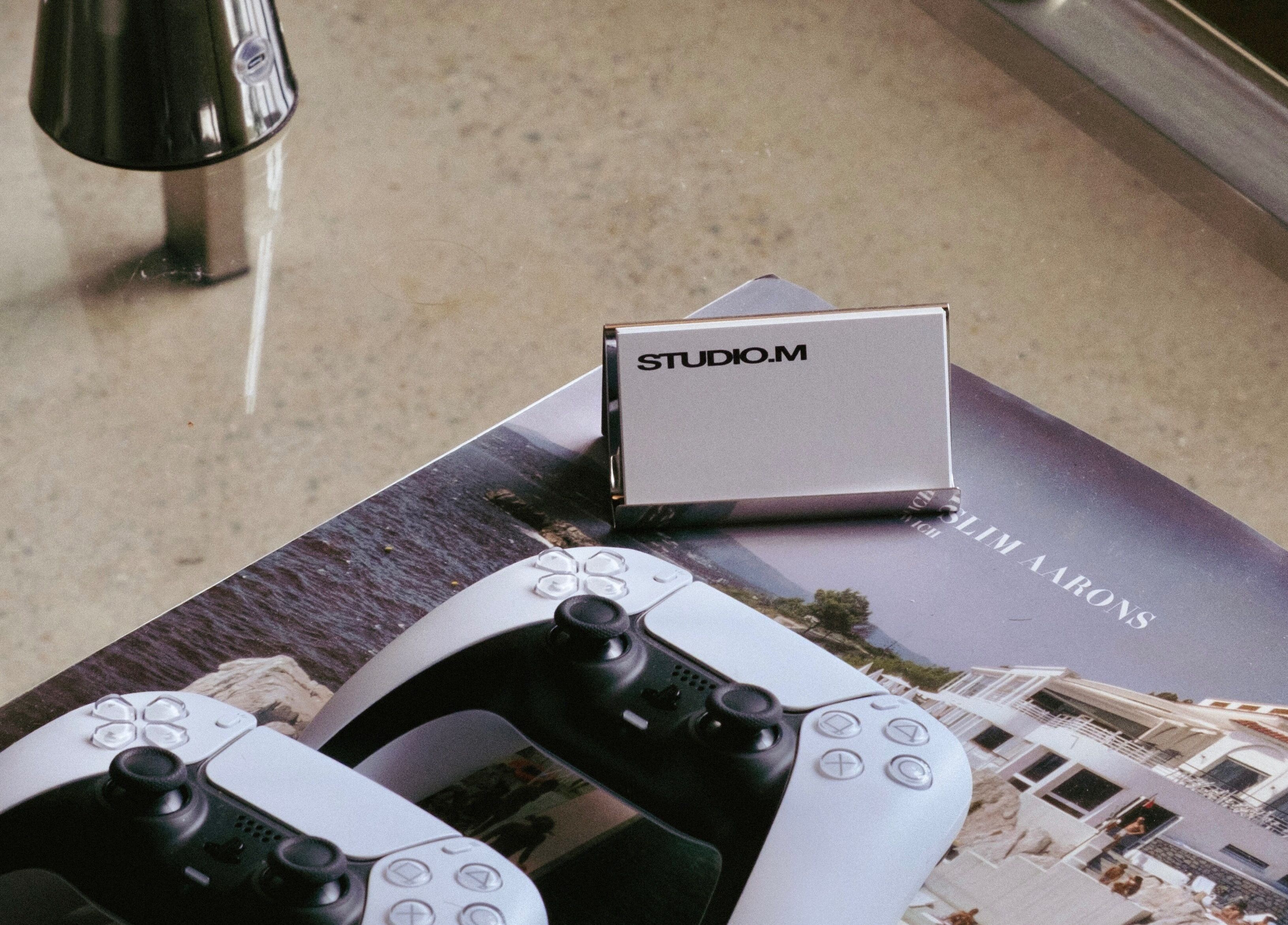 Receivers and booklet on a table at Studio.M, Camperdown, New South Wales, AU, showcasing modern aesthetic.