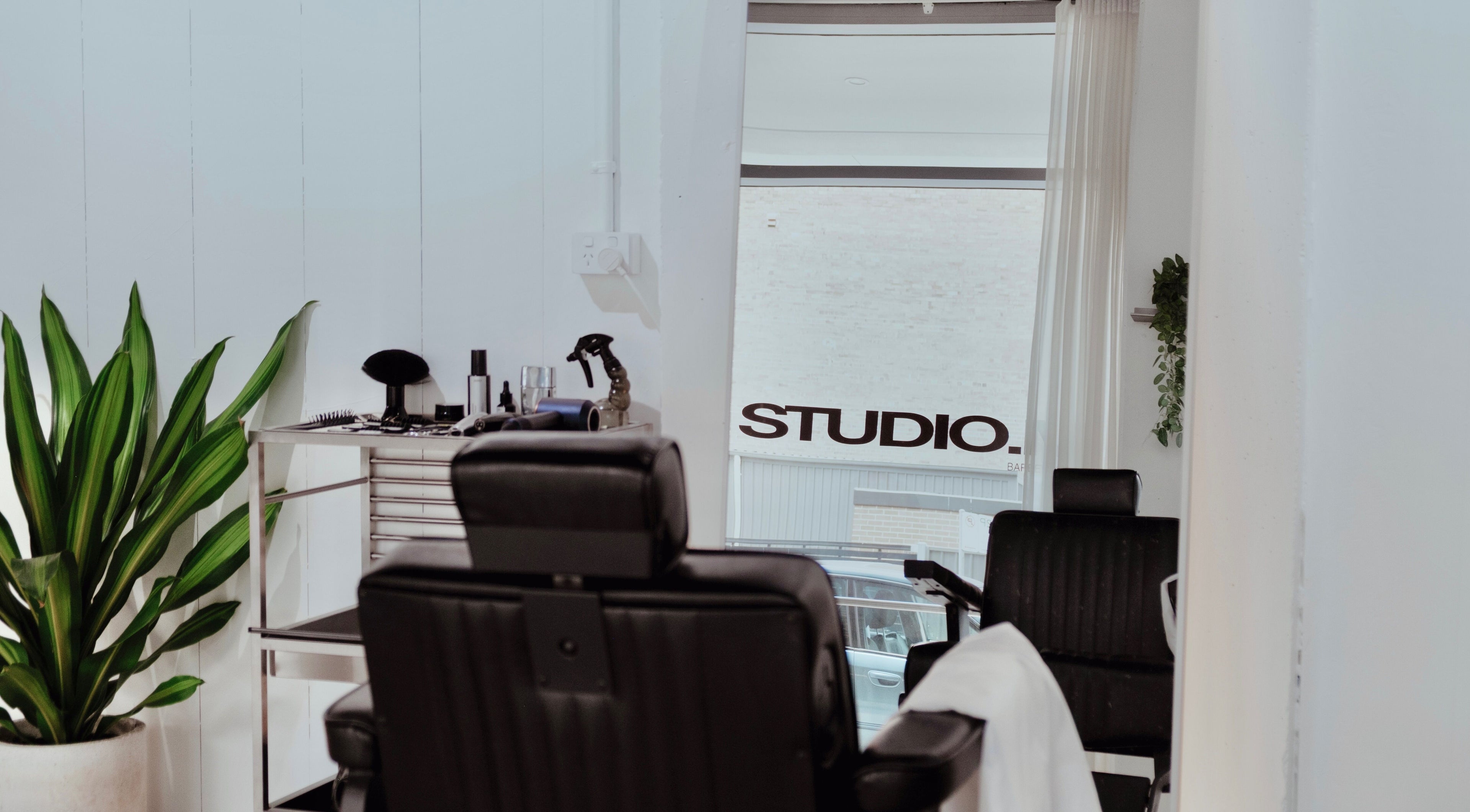 Stylish salon interior at STUDIO.M in Camperdown, New South Wales, AU with modern decor and salon chair.