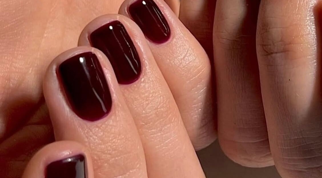 Glossy burgundy nails at Sage Beauty Boutique, Soham, England, GB, showcasing expert manicure artistry.
