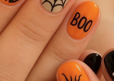 Halloween nail art with ghosts and webs at Sage Beauty Boutique in Soham, England, GB.