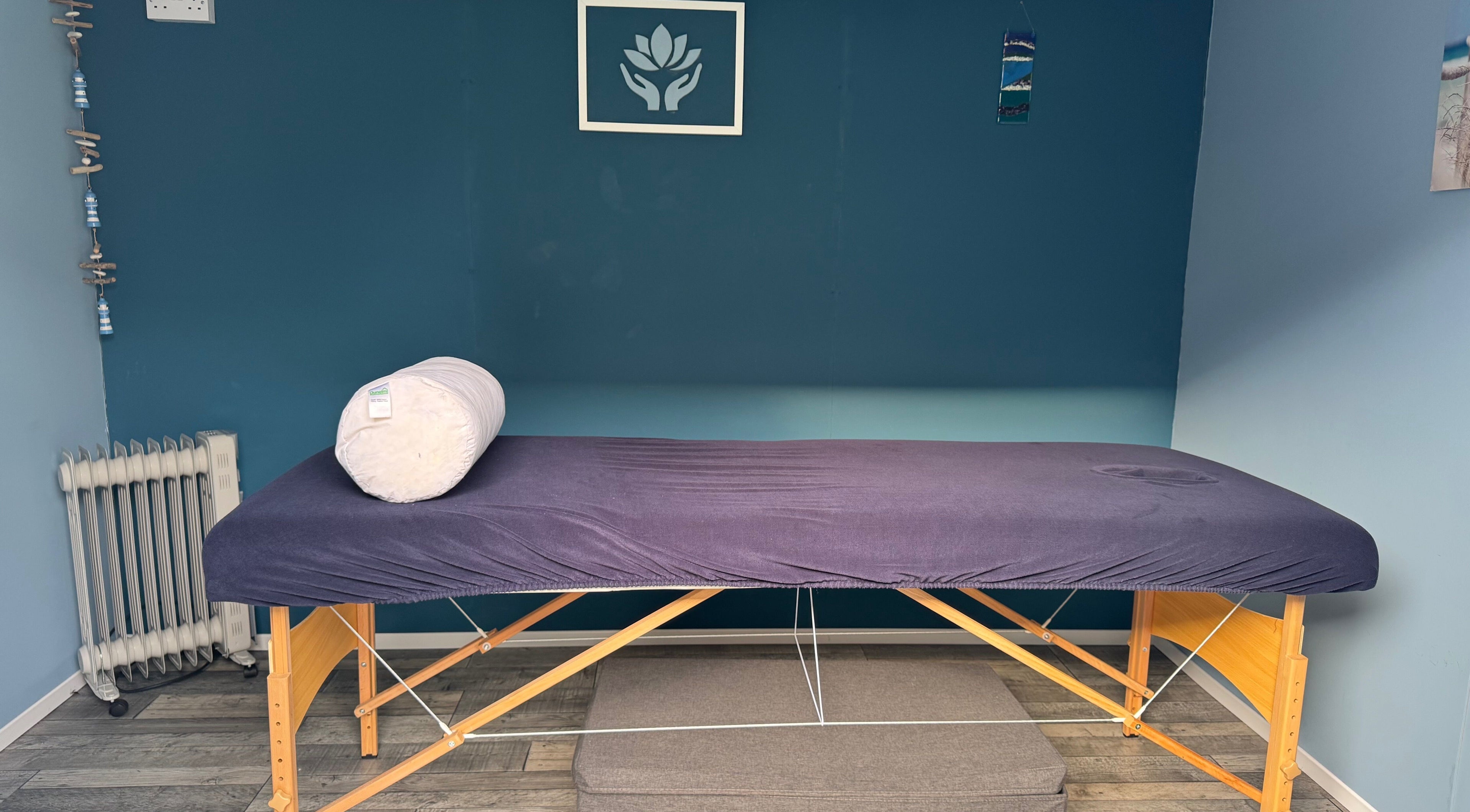 Relax & Unwind therapy room in Fareham, England, GB with massage table and calming decor.
