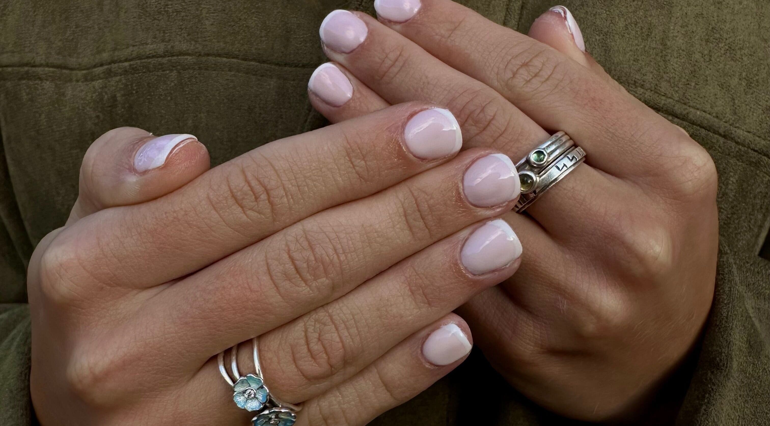 Close-up of manicured hands with pastel nails at Ten By Ten Nails, Kirkwall, Scotland, GB.