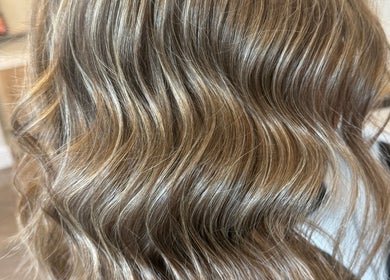 Golden wavy hair styled at Beau Hair, Gilberdyke, England, GB. Perfect for a chic and elegant look.