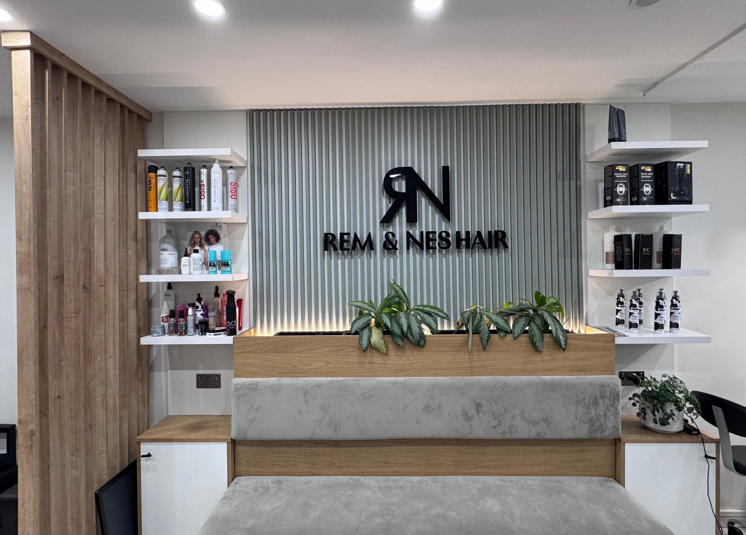Modern interior of Rem and Nes salon in London, England, GB showcasing stylish product display and seating.