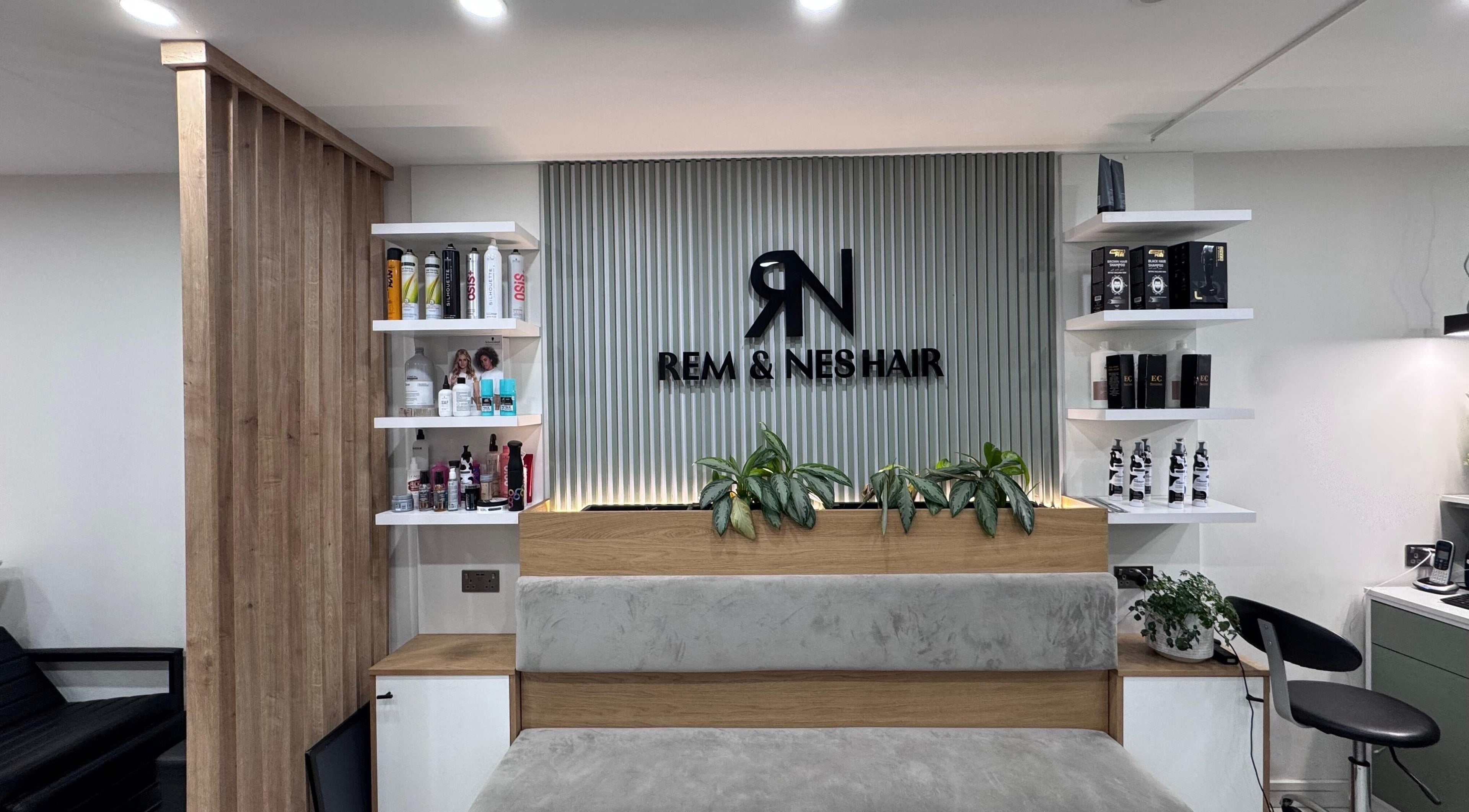 Modern interior of Rem and Nes salon in London, England, GB showcasing stylish product display and seating.