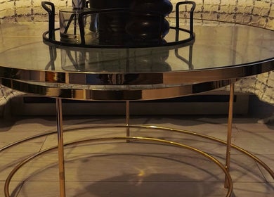 Elegant glass table with gold accents at Lunaria Aesthetics, Nazeing, England, GB. Stylish and inviting atmosphere.