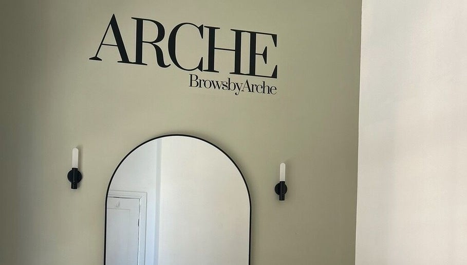Elegant interior at ARCHE in Guisborough, England, GB with stylish wall decor and modern mirror.