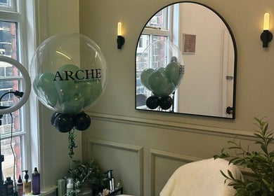 Elegant ARCHE beauty studio in Guisborough, England with a mirror, ring light, and decor.