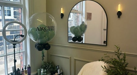 Elegant ARCHE beauty studio in Guisborough, England with a mirror, ring light, and decor.