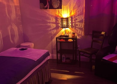 Tranquil massage room at A Magic Massage INC in Winter Park, Florida, US with gentle lighting.