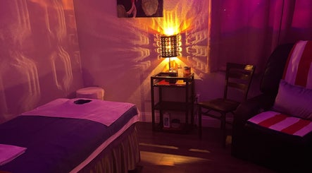 Tranquil massage room at A Magic Massage INC in Winter Park, Florida, US with gentle lighting.