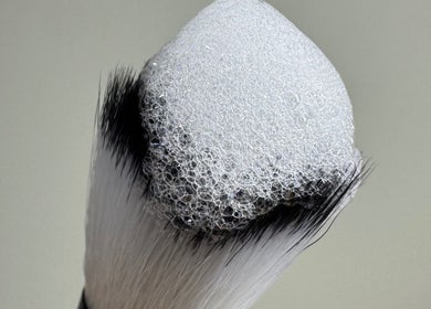 Foam-covered makeup brush at Lydia.Maria, Bedford, England, GB. Experience premium beauty care.