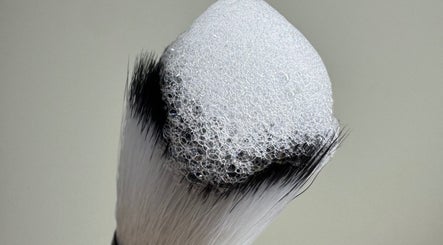 Foam-covered makeup brush at Lydia.Maria, Bedford, England, GB. Experience premium beauty care.