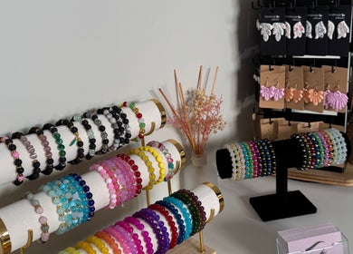 Stylish bracelets and earrings at Lydia.Maria in Bedford, England, GB, showcasing vibrant jewelry display.