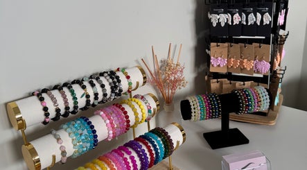 Stylish bracelets and earrings at Lydia.Maria in Bedford, England, GB, showcasing vibrant jewelry display.