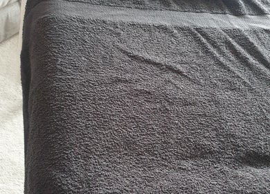 A comfortable massage table with a dark towel at Knotts Massage, Nottingham, England, GB.