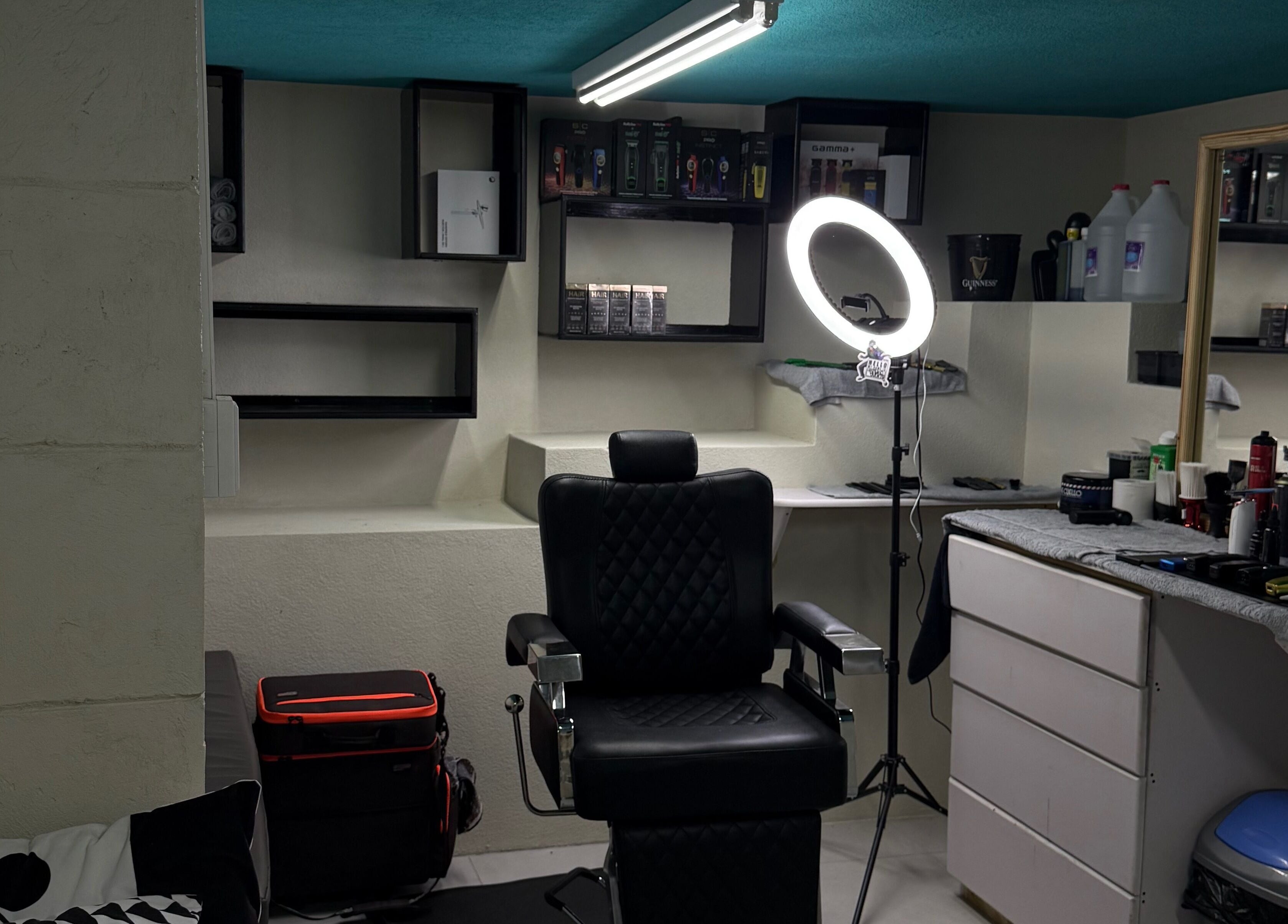 Professional styling chair and equipment at HTB, Merricks, Saint Philip, BB lighting up modern salon space.