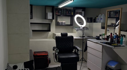 Professional styling chair and equipment at HTB, Merricks, Saint Philip, BB lighting up modern salon space.