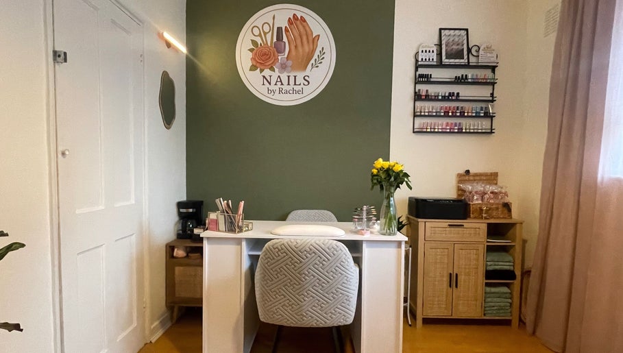 Modern nail salon interior at Nails by Rachel, London, England, GB, showcasing elegant decor and organized polish display.