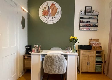 Modern nail salon interior at Nails by Rachel, London, England, GB, showcasing elegant decor and organized polish display.