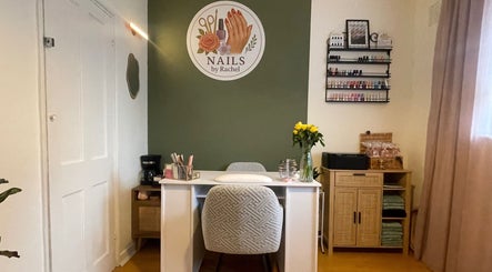 Modern nail salon interior at Nails by Rachel, London, England, GB, showcasing elegant decor and organized polish display.