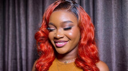 Client with radiant red curls at Elsie Beautié, Birmingham, England, GB, showcasing expert hairstyling.