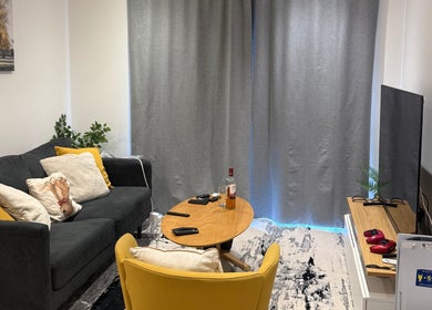 Comfortable seating area at Elsie Beautié, Birmingham, England, GB featuring a sofa, table, and decor.
