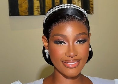 Radiant bride at Elsie Beautié in Birmingham, England, GB, showcasing flawless makeup and elegant hairstyle.