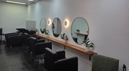 Modern salon interior of Papillon salon in Hendra, Queensland, AU with stylish mirrors and seating.