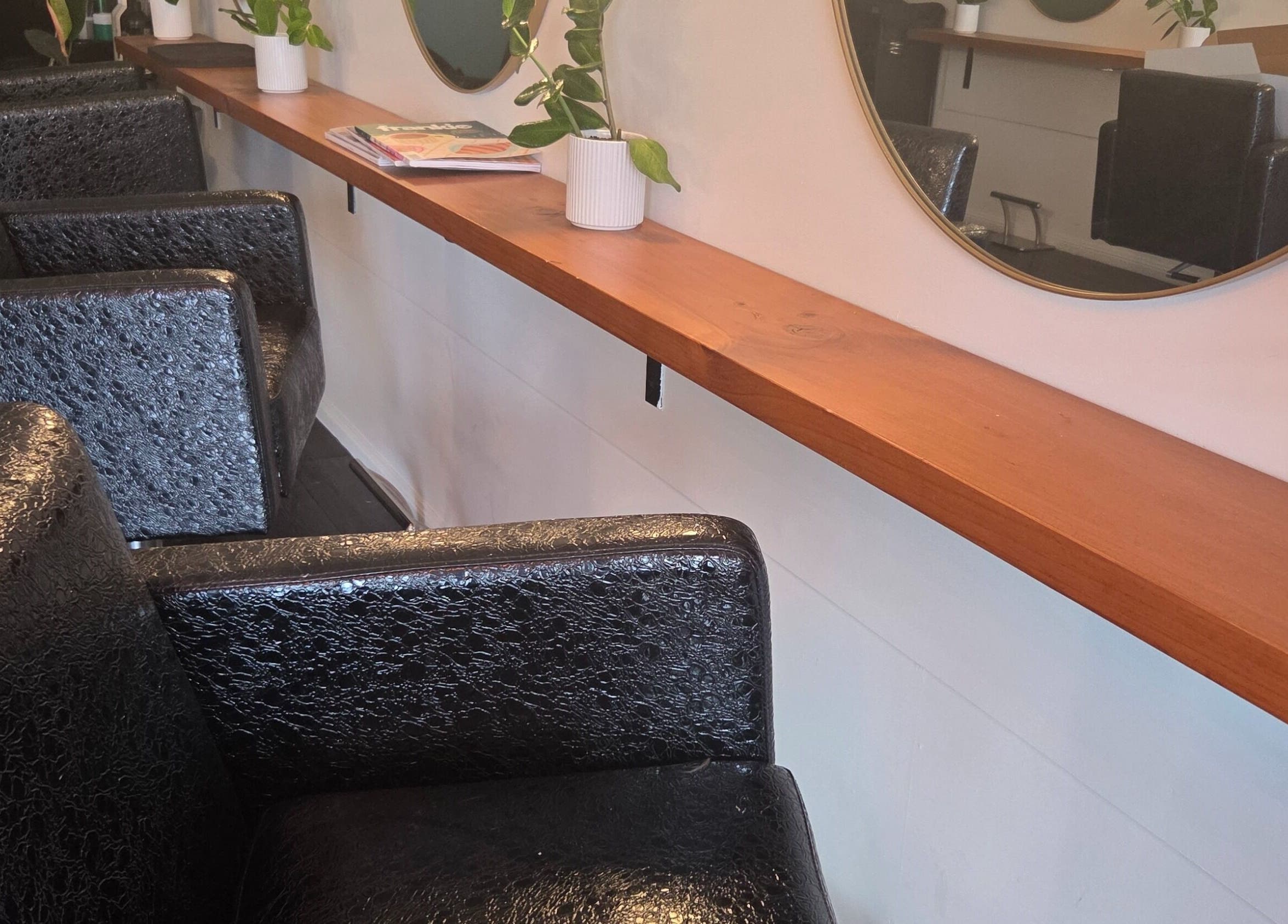 Chic seating and mirrors at Papillon salon, Hendra, Queensland, AU. Modern beauty venue design.