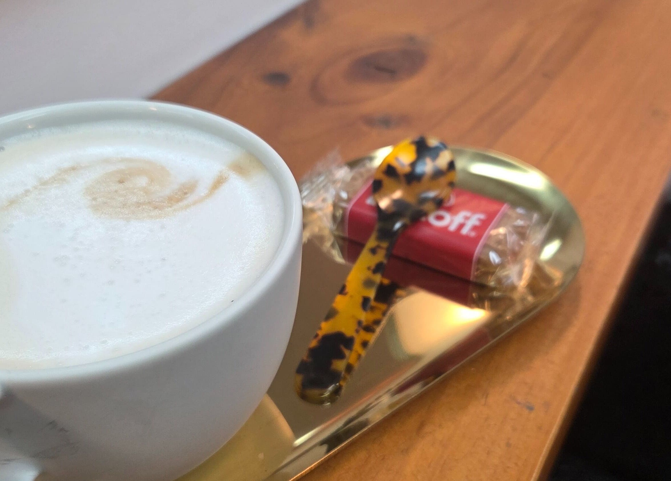 Warm coffee with biscotti at Papillon salon, Hendra, Queensland, AU.