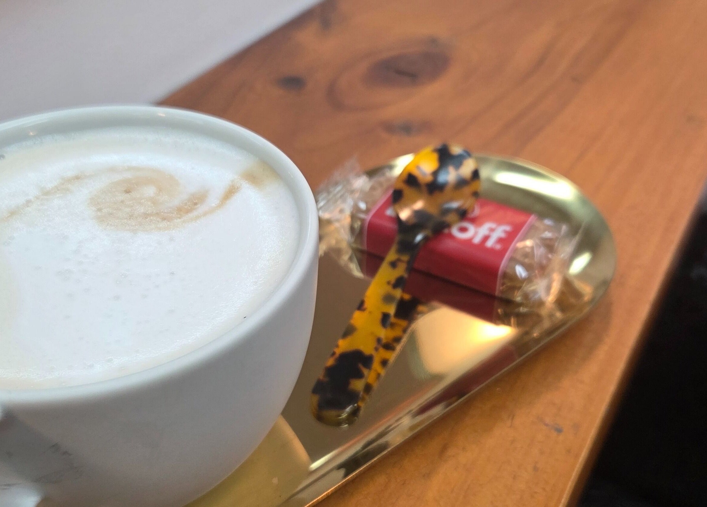 Warm coffee with biscotti at Papillon salon, Hendra, Queensland, AU.